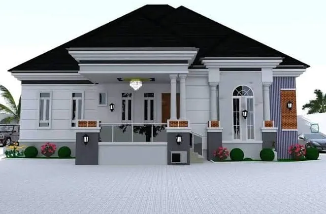White bungalow with a black stone-coated roof