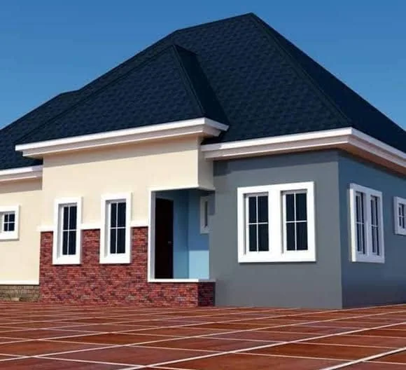 Grey house with a black stone-coated roof