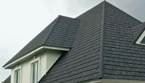 Grey shingle stone-coated roof on a white house